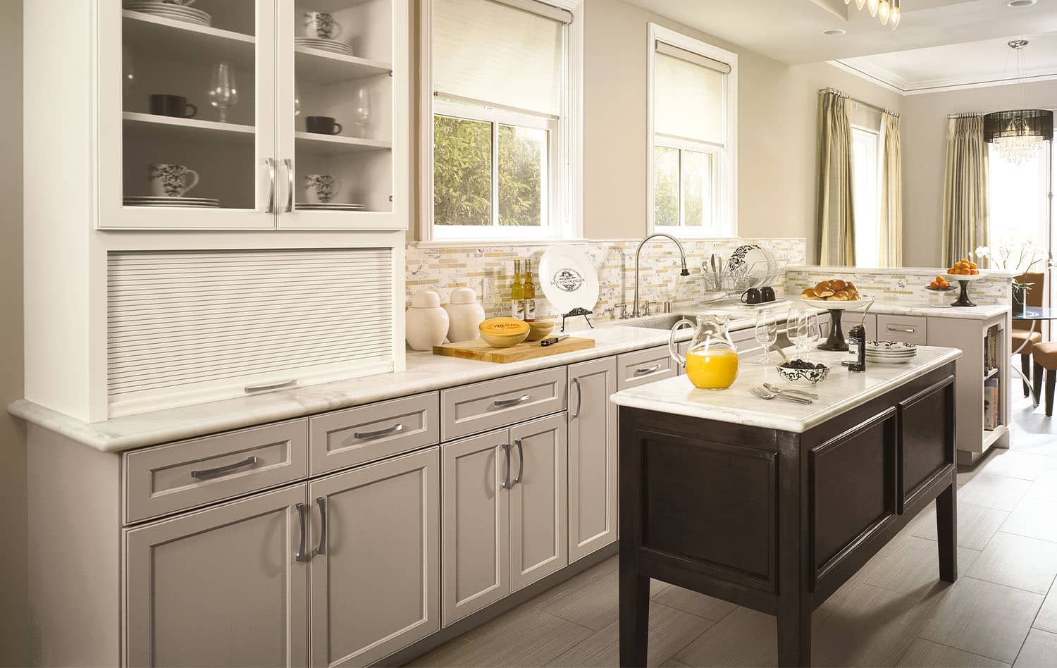 Kitchen with gray cabinets and a dark wood island