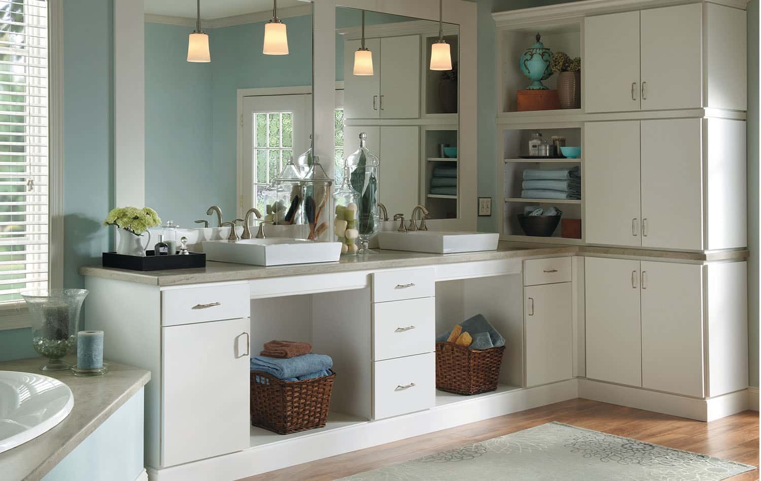 Bathroom with a double vanity, open shelving and pendant lights