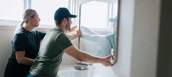 Renovated bathroom with a walk-in shower and modern vanity